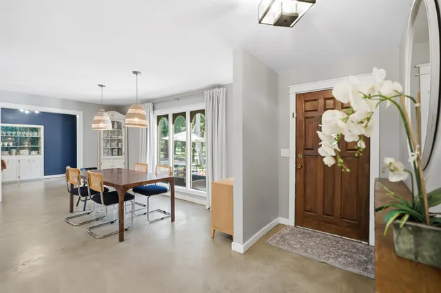 a living room with fireplace furniture and a flat screen tv