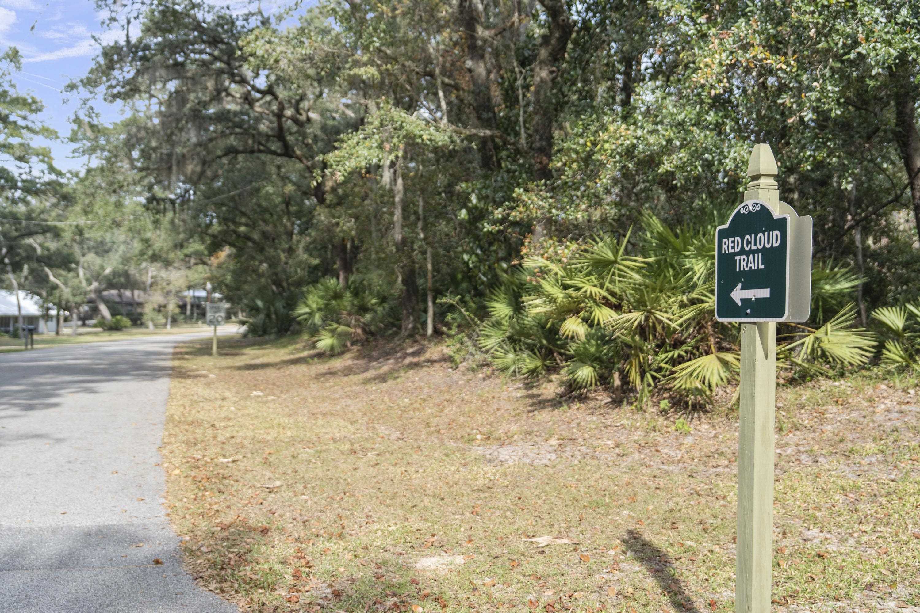 3572 Red Cloud Trail St. Augustine, FL 32086 - Photo 73 of 74 a street sign on a sidewalk next to a road