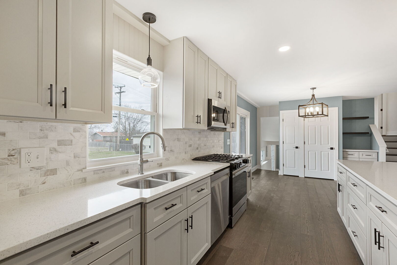 1910 Ashley Road Hoffman Estates, IL 60169 - Photo 11 of 30 a kitchen with a sink and cabinets