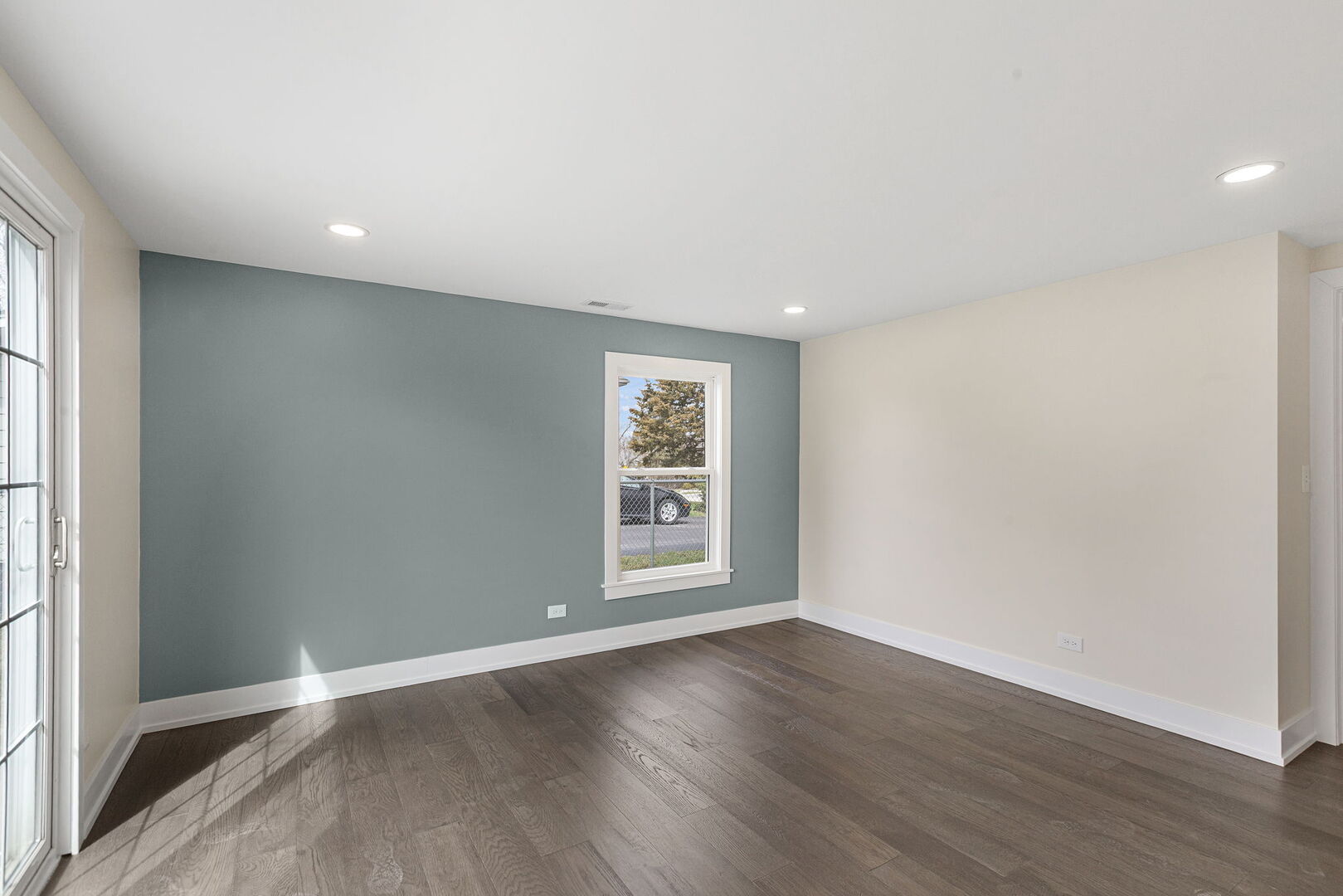 1910 Ashley Road Hoffman Estates, IL 60169 - Photo 13 of 30 an empty room with wooden floor and windows