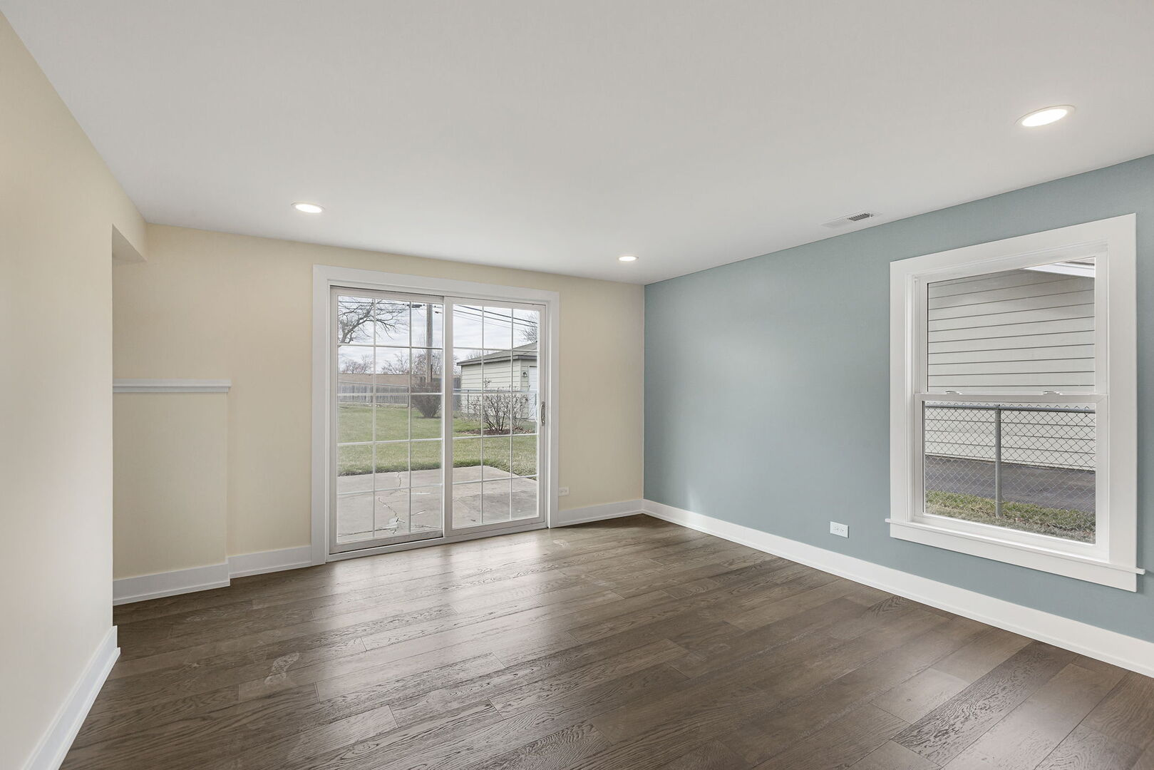 1910 Ashley Road Hoffman Estates, IL 60169 - Photo 14 of 30 a view of an empty room with wooden floor and a window
