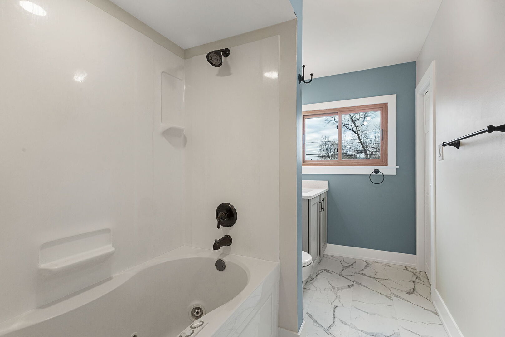 1910 Ashley Road Hoffman Estates, IL 60169 - Photo 17 of 30 a bathroom with a bathtub and shower