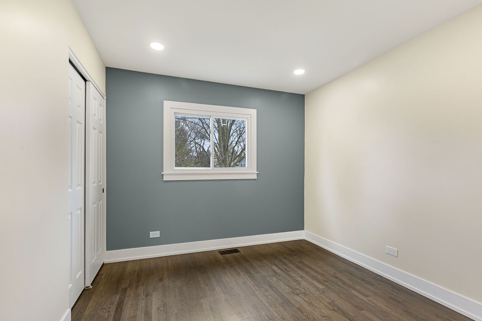 1910 Ashley Road Hoffman Estates, IL 60169 - Photo 18 of 30 an empty room with wooden floor and windows