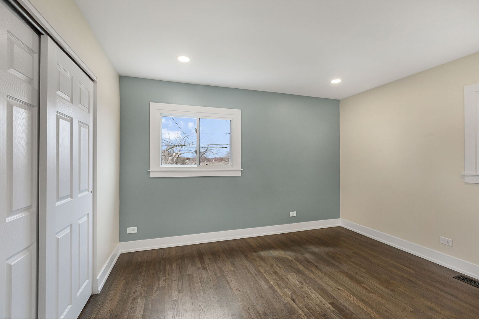 1910 Ashley Road Hoffman Estates, IL 60169 - Photo 20 of 30 an empty room with wooden floor and windows
