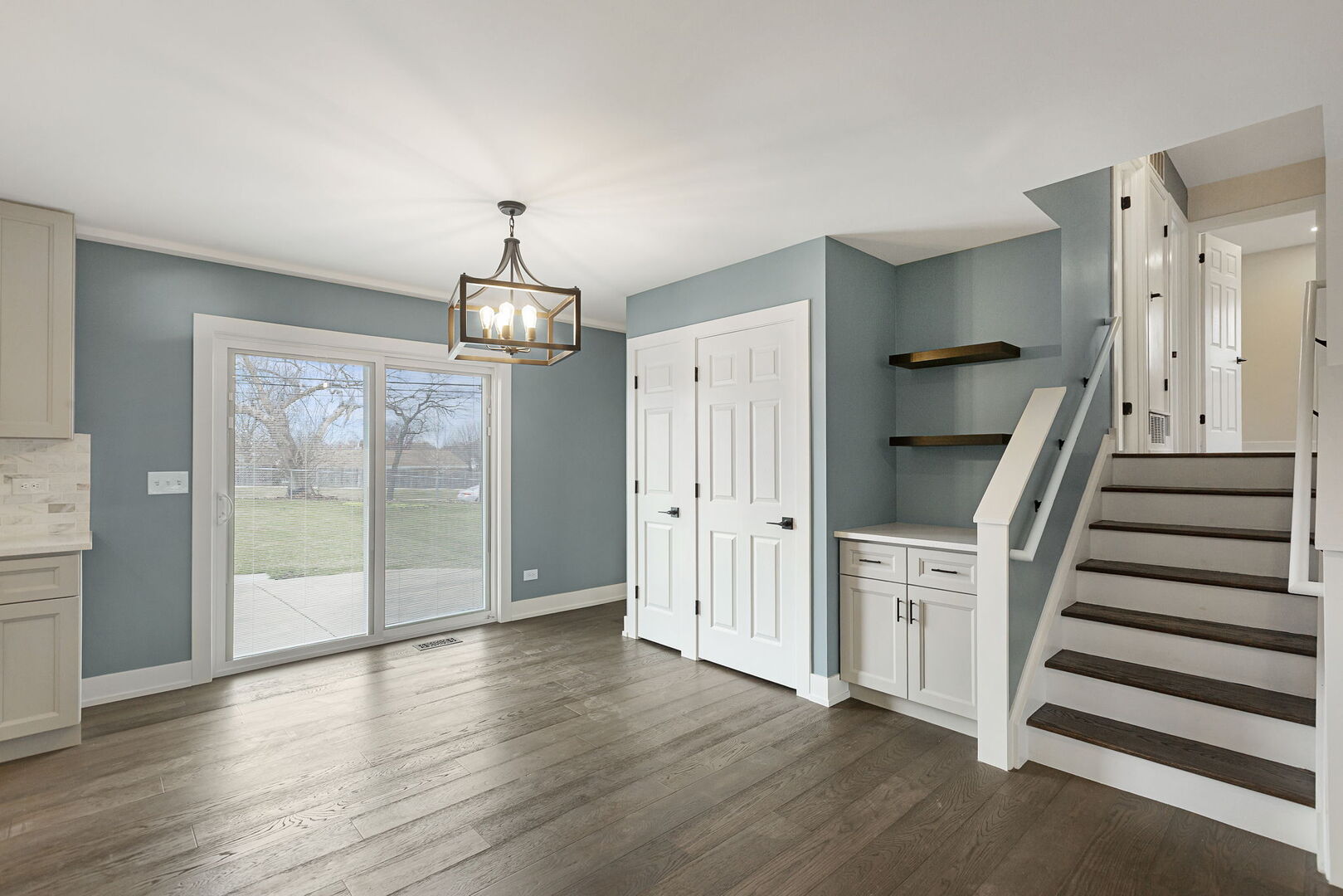 1910 Ashley Road Hoffman Estates, IL 60169 - Photo 5 of 30 wooden floor in an empty room with a window