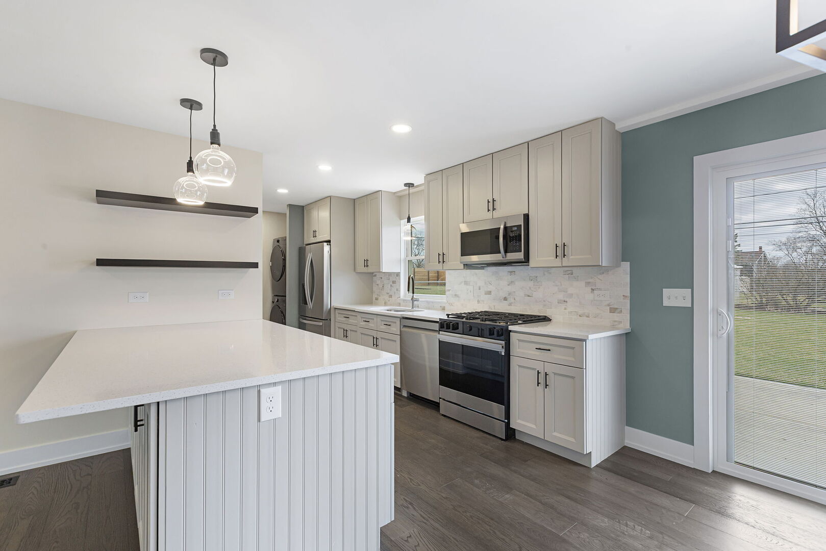 1910 Ashley Road Hoffman Estates, IL 60169 - Photo 8 of 30 a kitchen with a stove a sink and a refrigerator