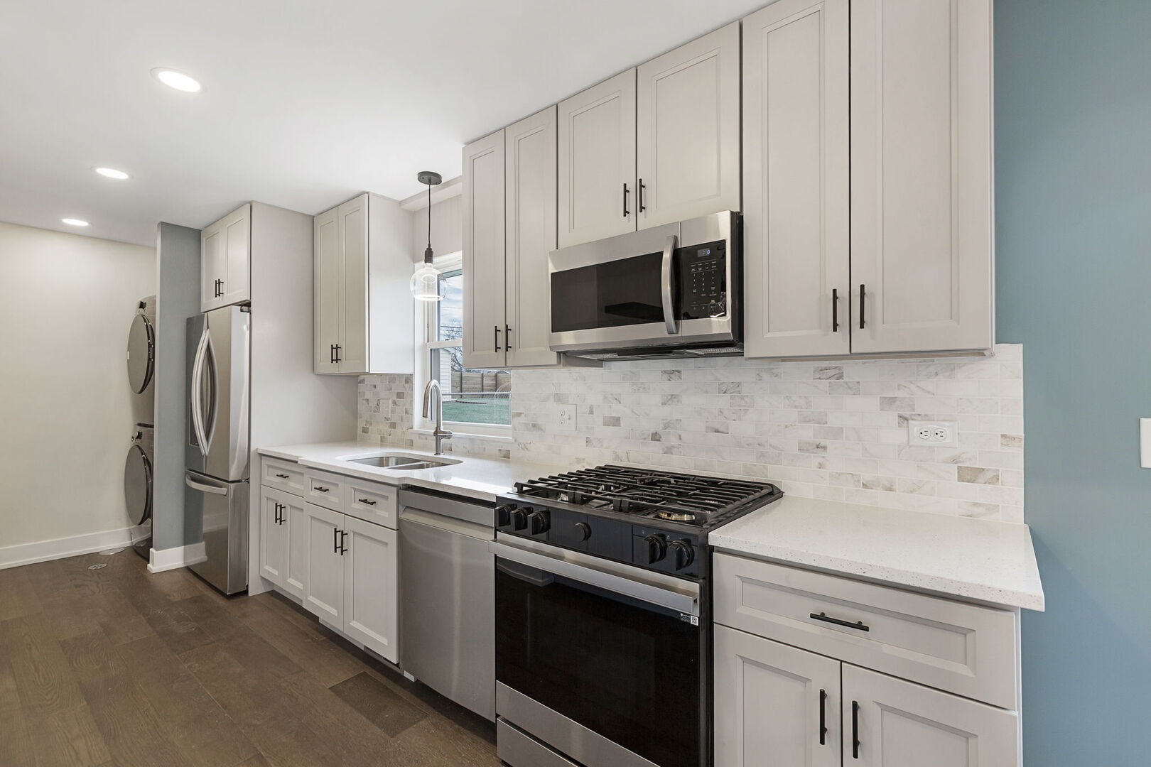 1910 Ashley Road Hoffman Estates, IL 60169 - Photo 10 of 30 a kitchen with stainless steel appliances a stove microwave and refrigerator