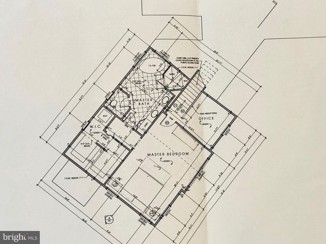 a bathroom with a sink vanity and toilet