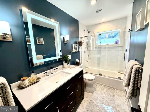 a bathroom with a sink double vanity and a mirror