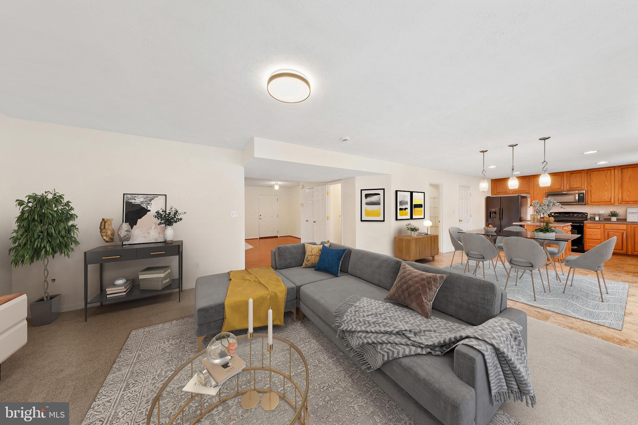 1612 Cattail Commons Way Denton, MD 21629 - Photo 12 of 67 a living room with furniture and a dining table with kitchen view