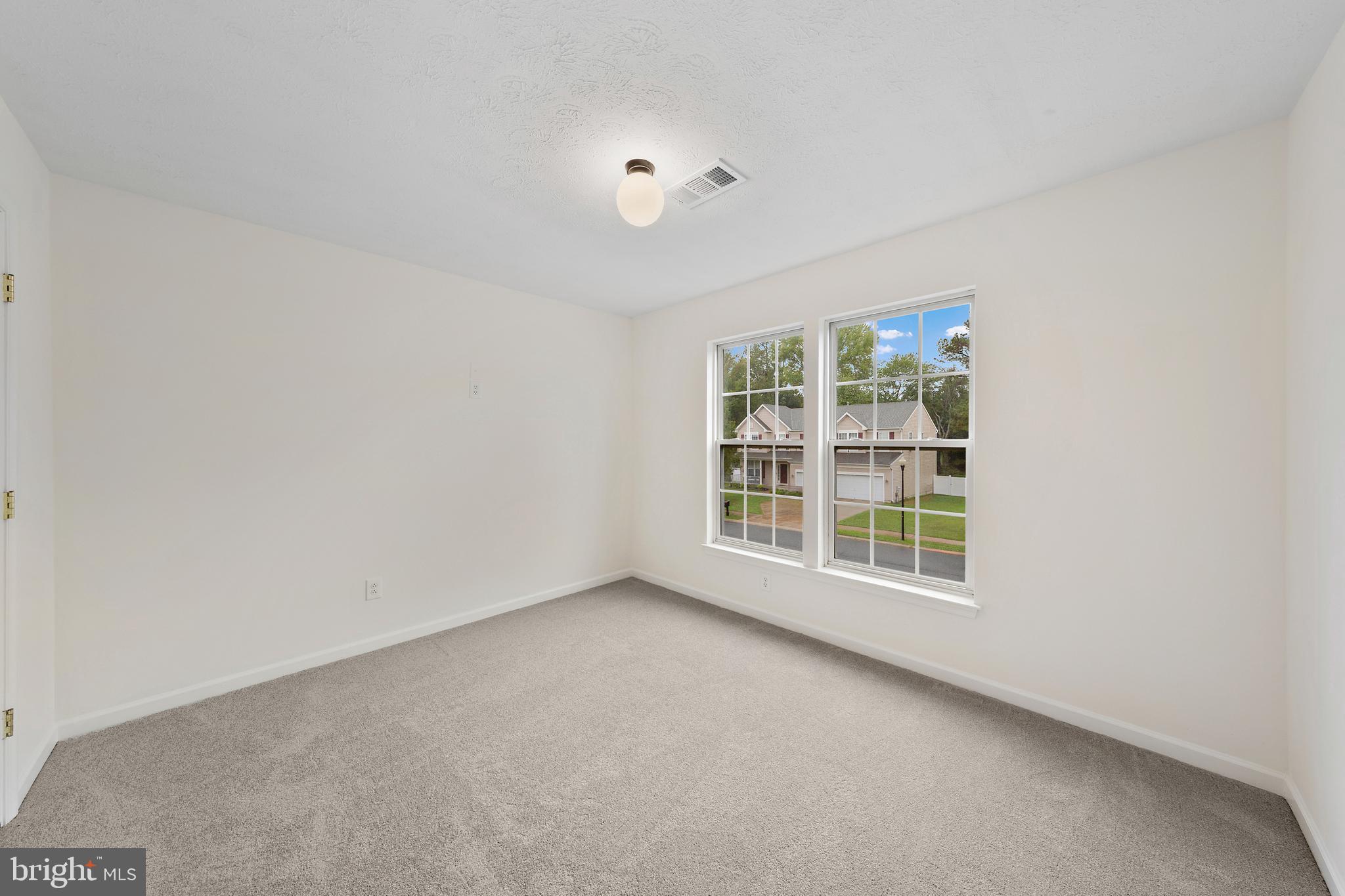 1612 Cattail Commons Way Denton, MD 21629 - Photo 29 of 67 an empty room with a window