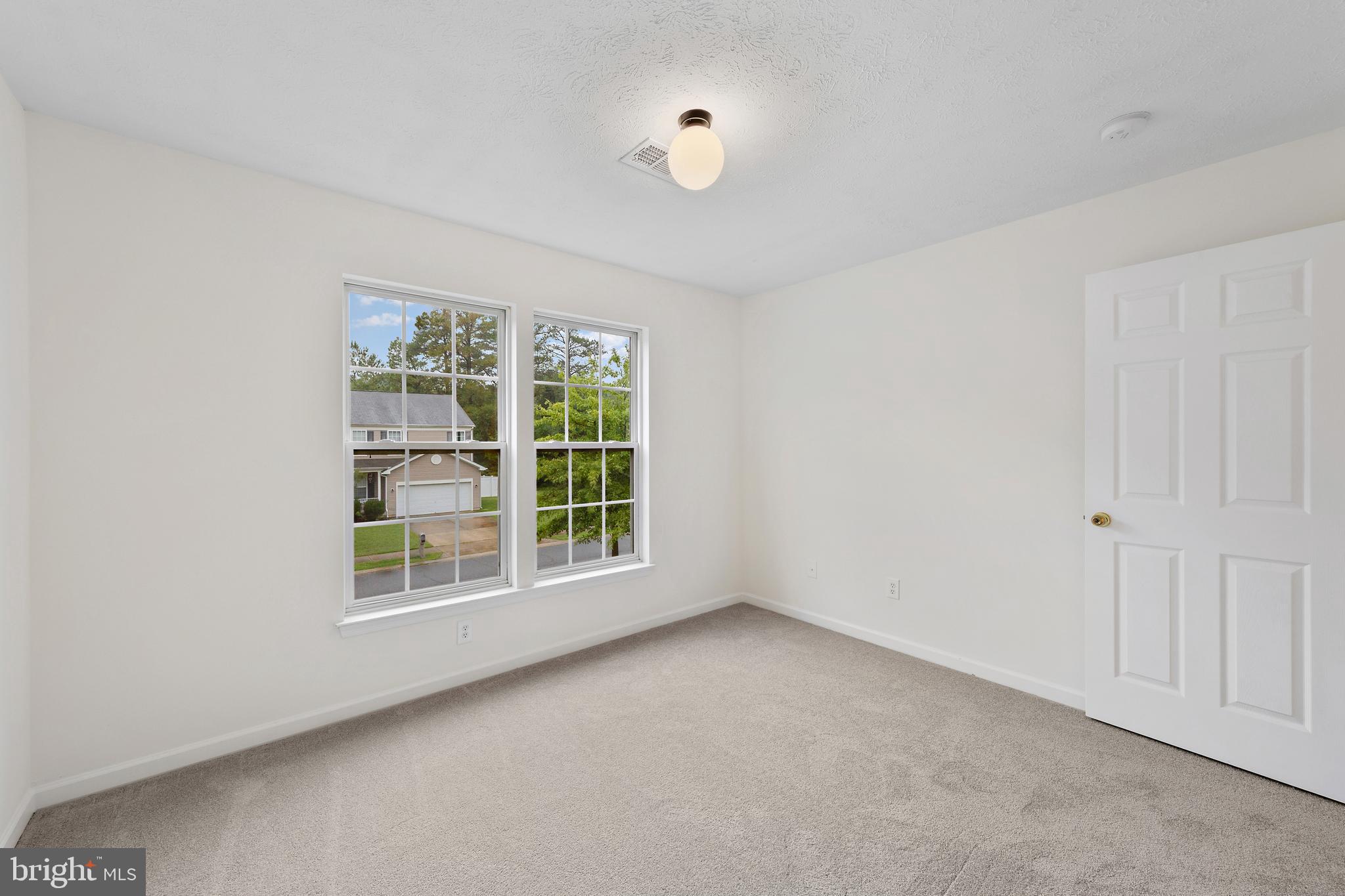 1612 Cattail Commons Way Denton, MD 21629 - Photo 32 of 67 an empty room with a window