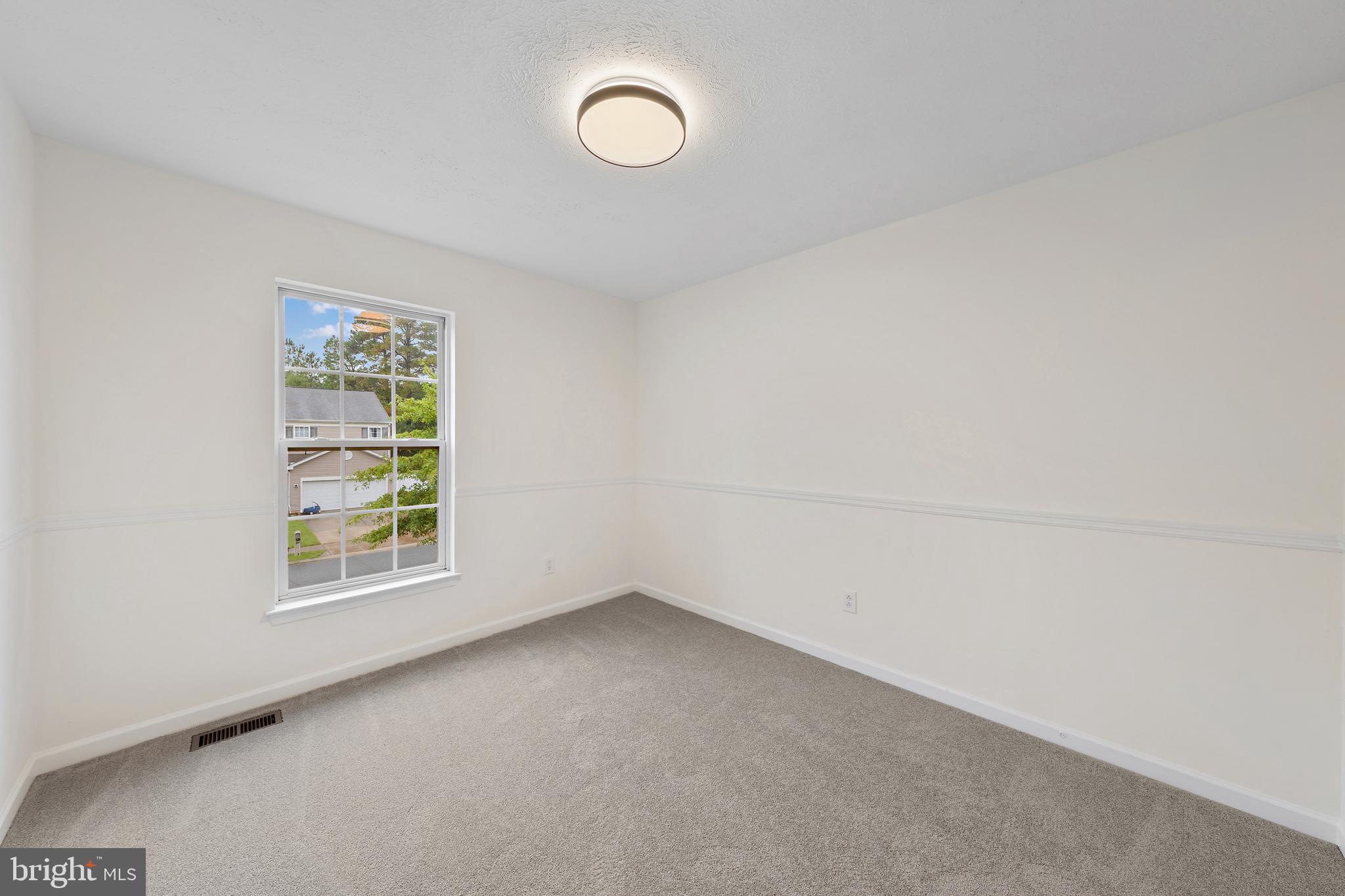 1612 Cattail Commons Way Denton, MD 21629 - Photo 34 of 67 an empty room with a window