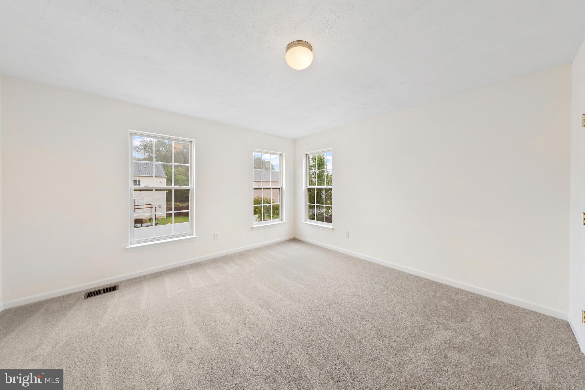 1612 Cattail Commons Way Denton, MD 21629 - Photo 41 of 67 an empty room with windows