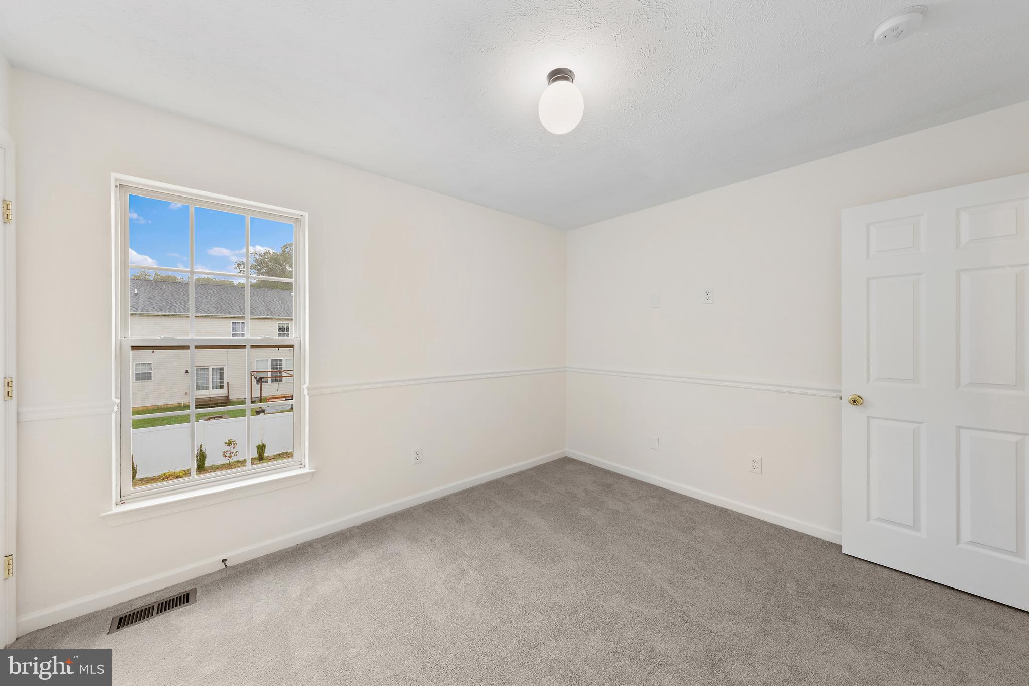 1612 Cattail Commons Way Denton, MD 21629 - Photo 48 of 67 a view of an empty room with a window