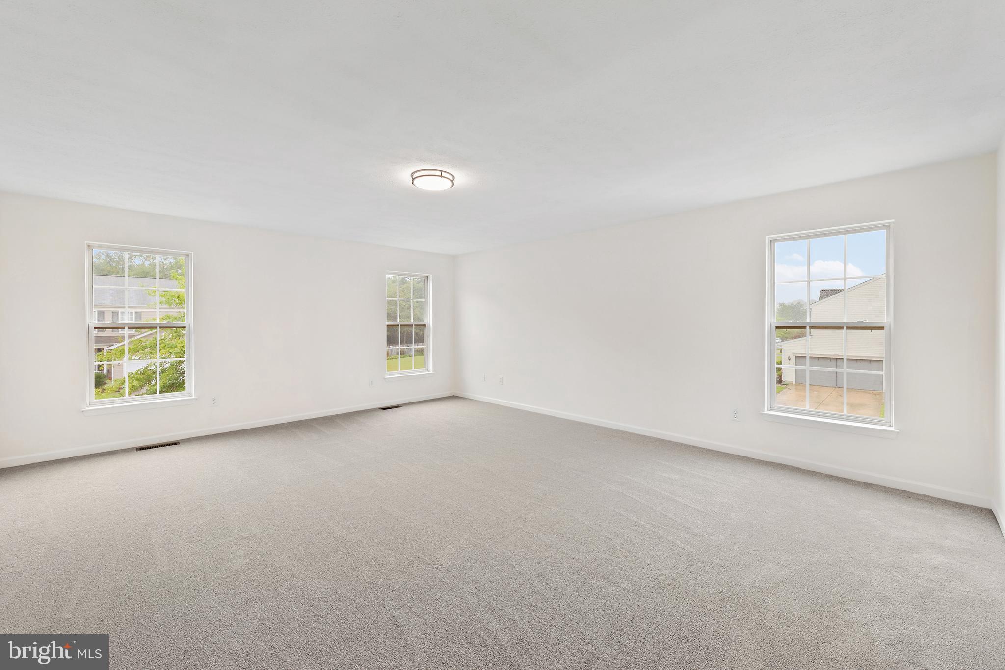 1612 Cattail Commons Way Denton, MD 21629 - Photo 50 of 67 an empty room with windows