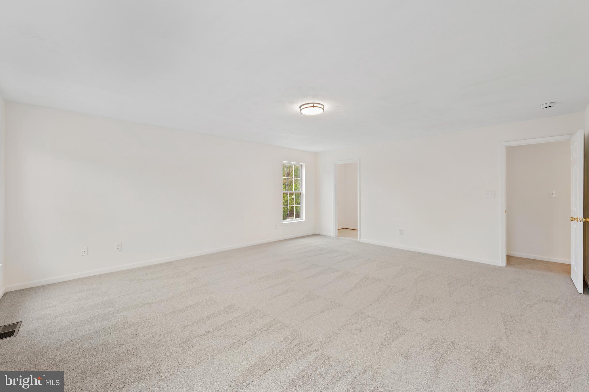 1612 Cattail Commons Way Denton, MD 21629 - Photo 51 of 67 a view of an empty room with a window