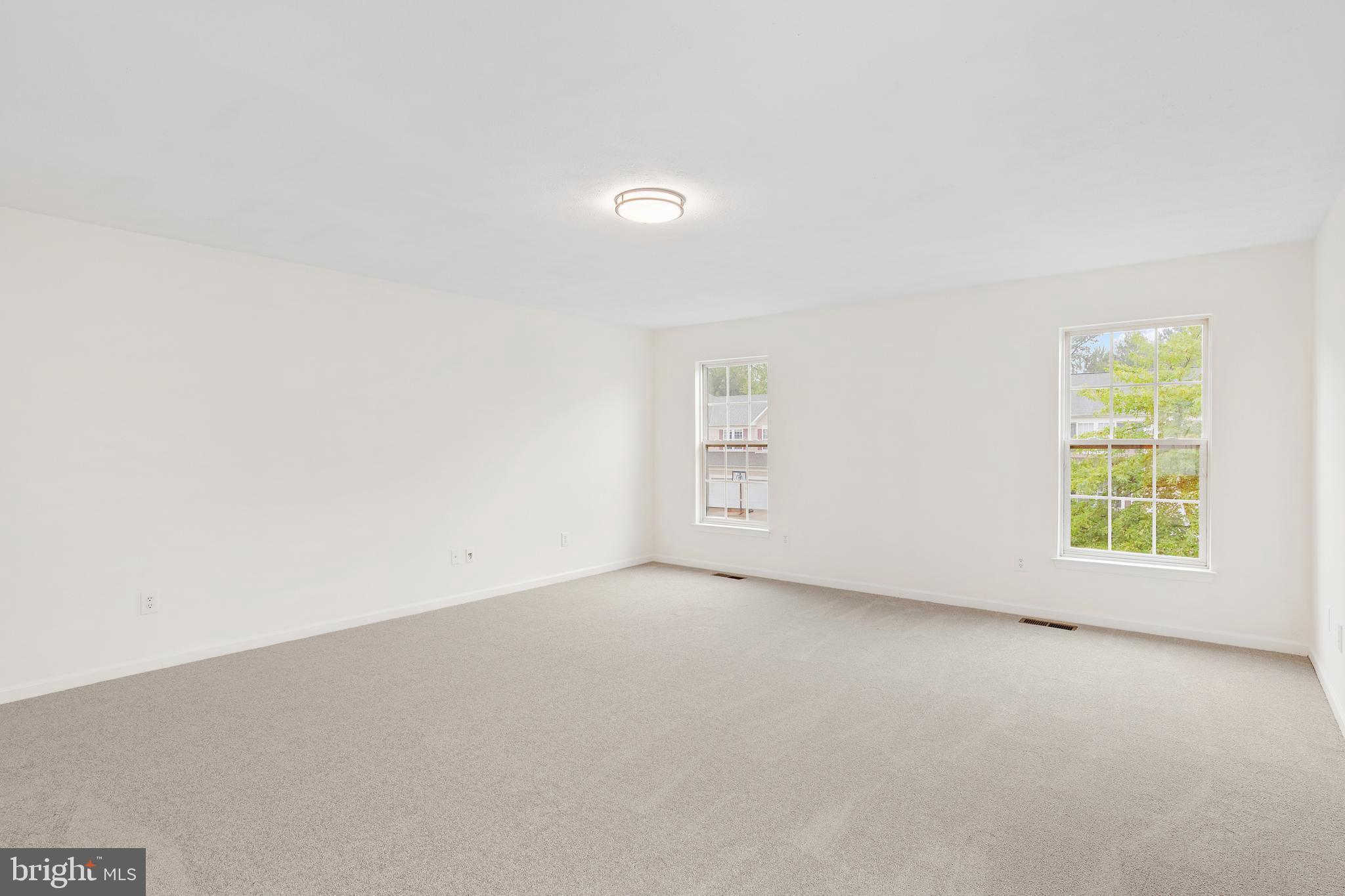 1612 Cattail Commons Way Denton, MD 21629 - Photo 53 of 67 an empty room with windows