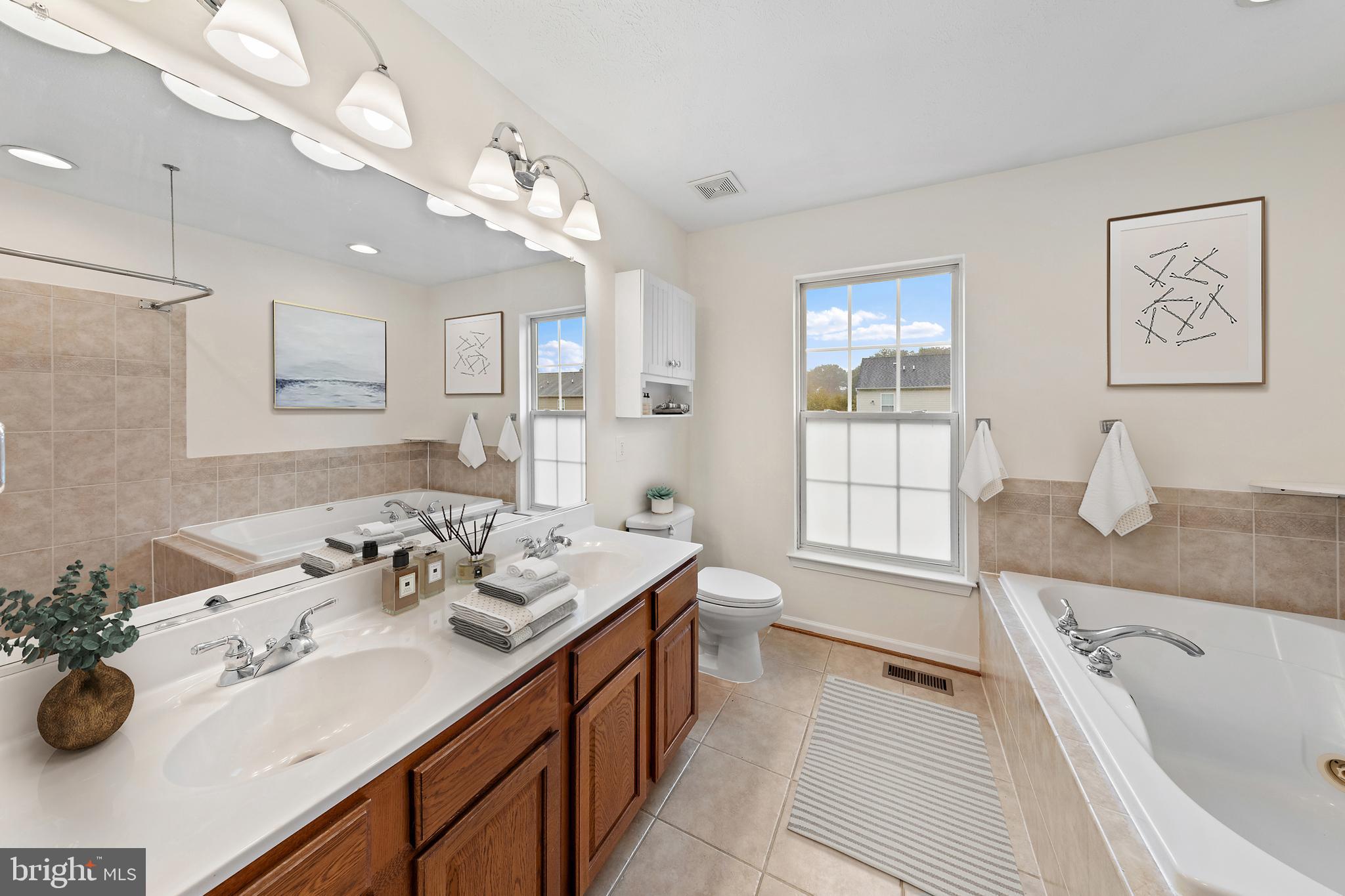 1612 Cattail Commons Way Denton, MD 21629 - Photo 55 of 67 a spacious bathroom with a tub sink and mirror