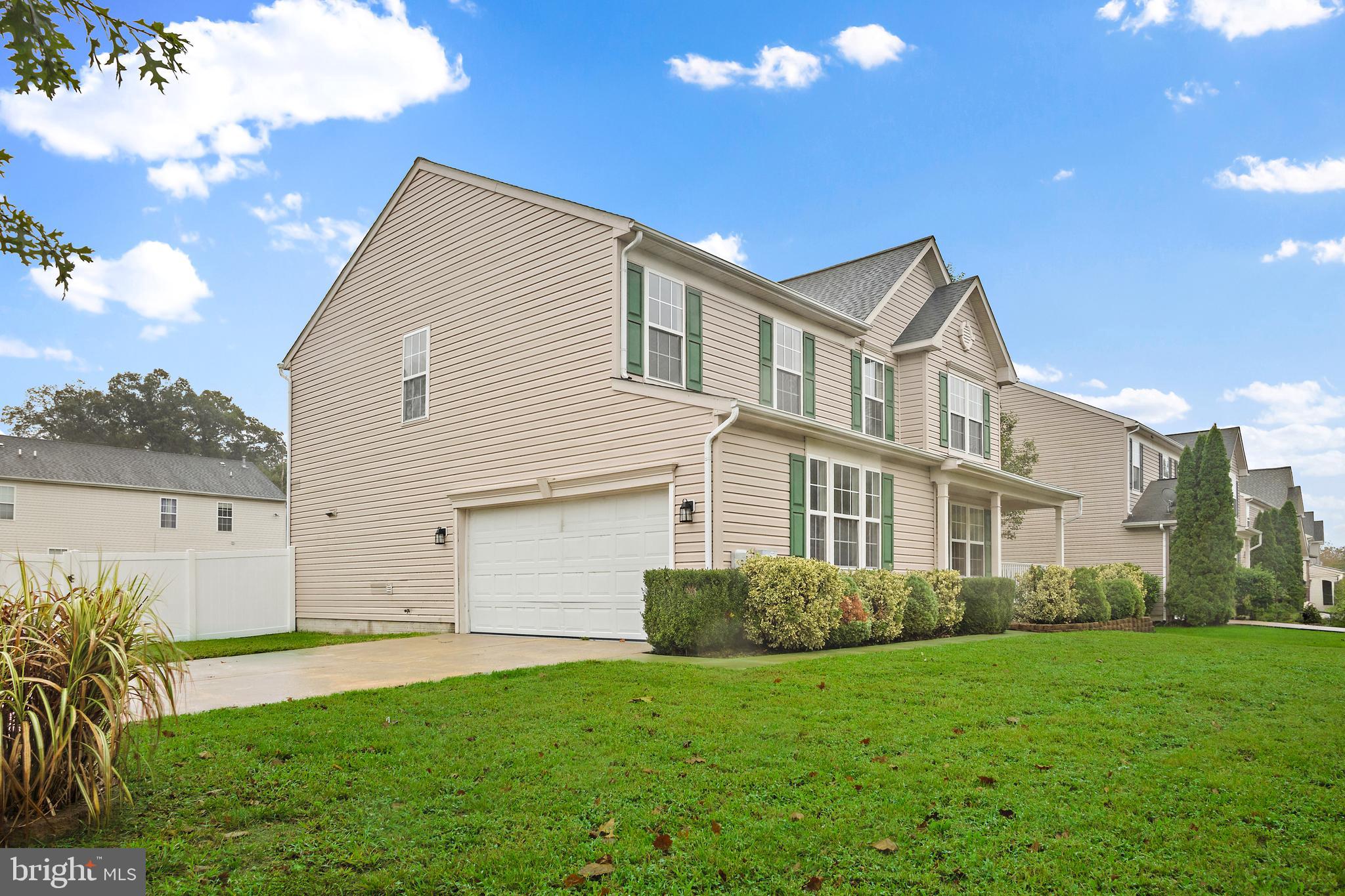 1612 Cattail Commons Way Denton, MD 21629 - Photo 66 of 67 a front view of a house with a garden