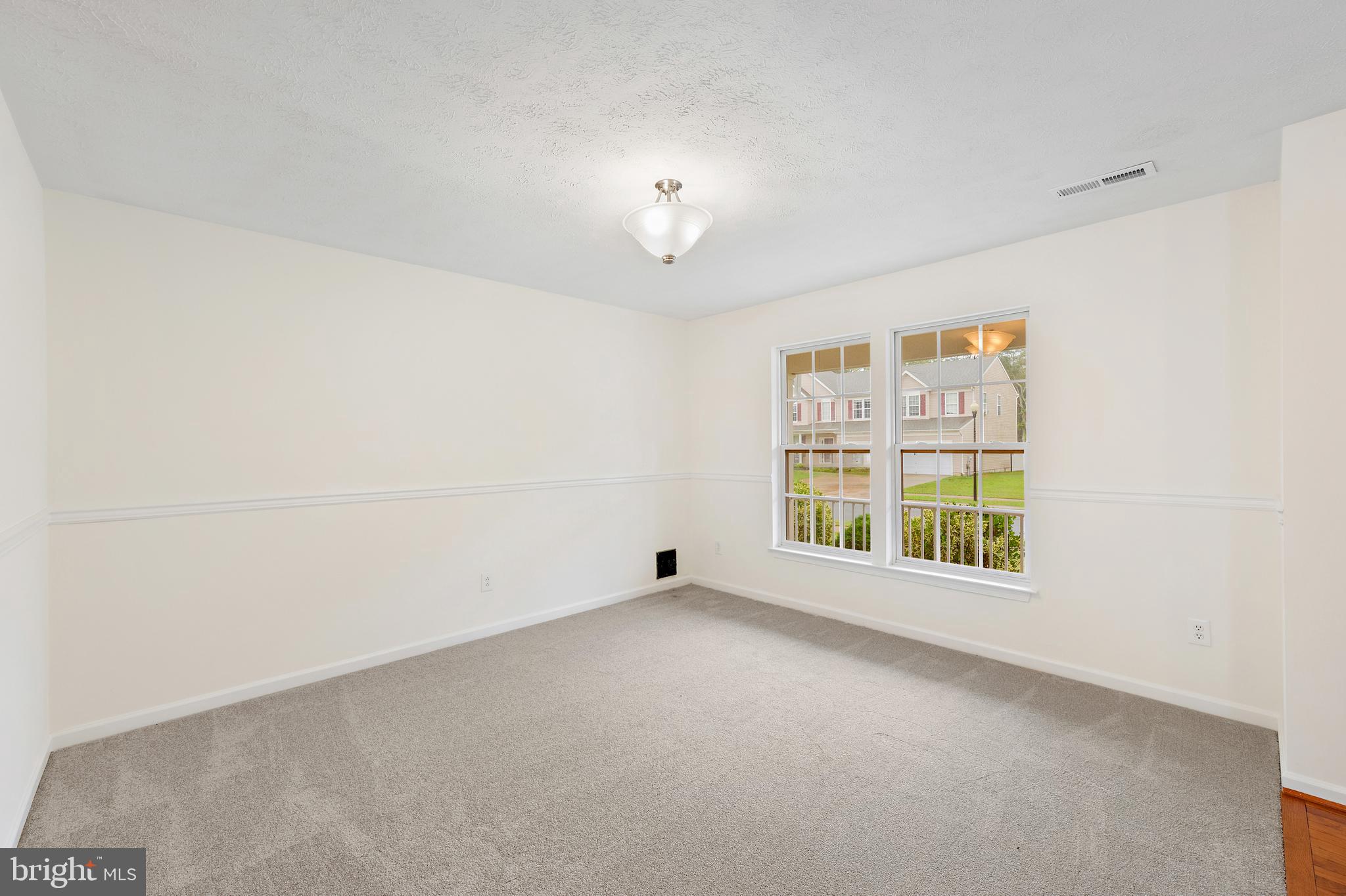 1612 Cattail Commons Way Denton, MD 21629 - Photo 9 of 67 an empty room with a empty space and windows