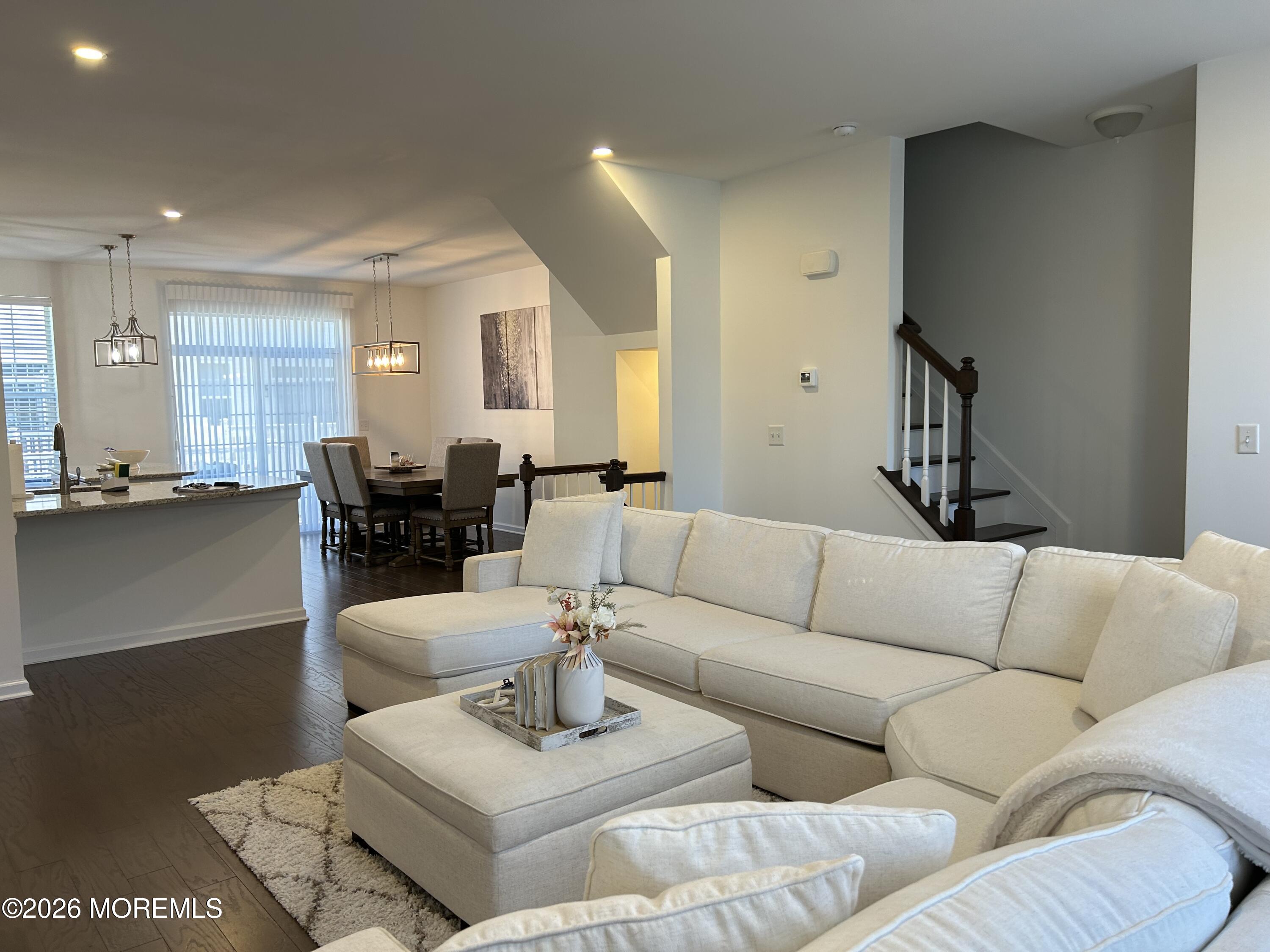 105 Revival Road, Unit 1305 Brick, NJ 08723 - Photo 21 of 36 LR SHOWING STAIRS AND KITCHEN