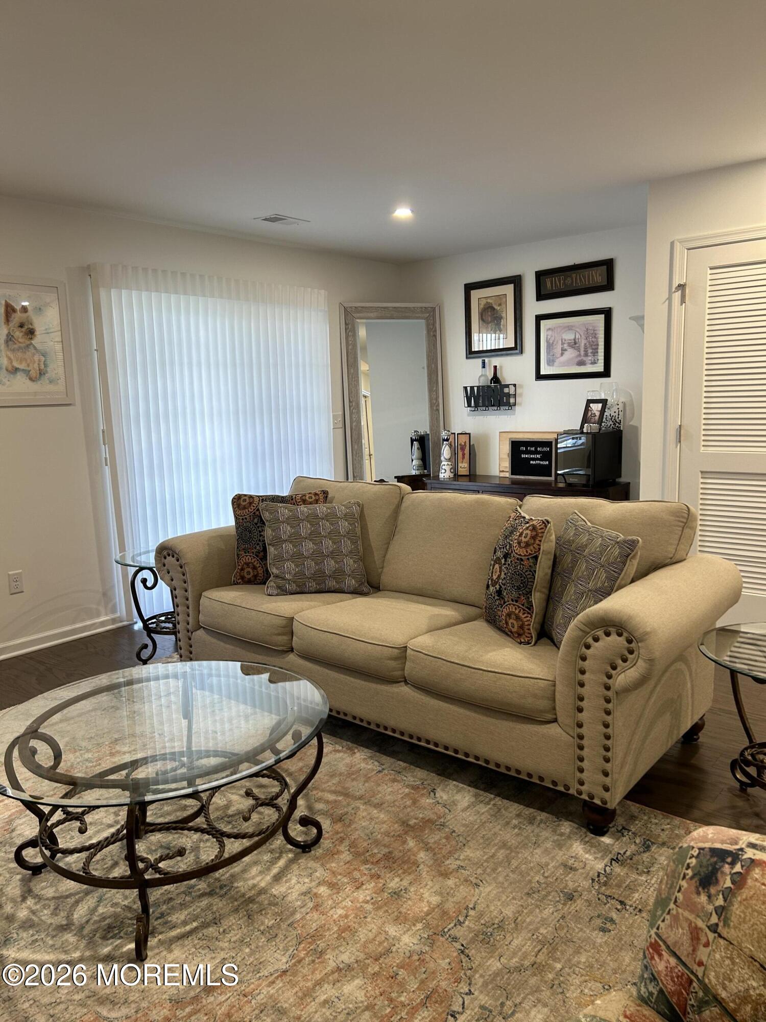 105 Revival Road, Unit 1305 Brick, NJ 08723 - Photo 7 of 36 DOWNSTAIRS LR TOWARD SLIDER