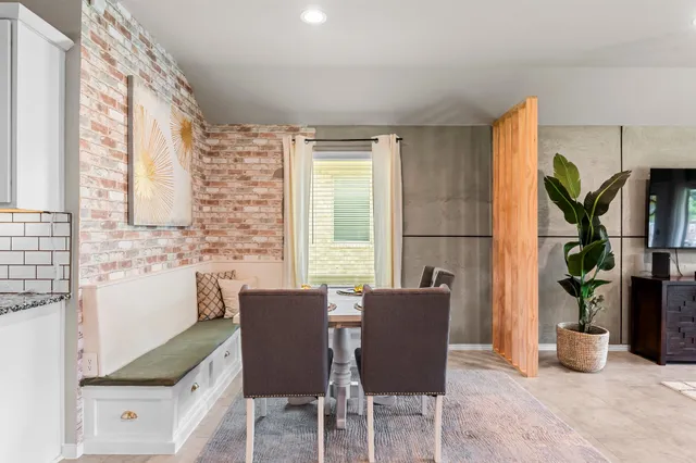 a view of a dining room with furniture window and outside view
