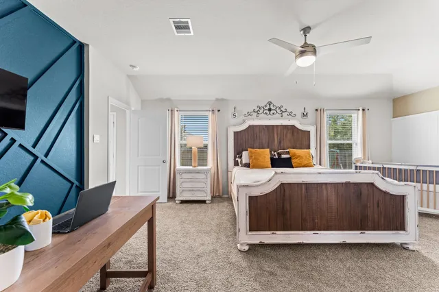 a bed room with furniture and a window