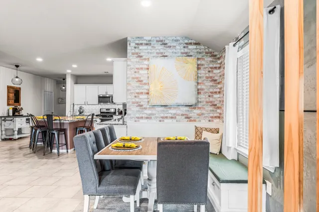a view of kitchen with furniture and a window