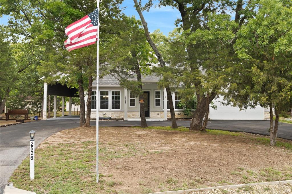 2526 Fox Point Circle Quinlan, TX 75474 - Photo 3 of 35 Circular drive provides ample parking for family and friends