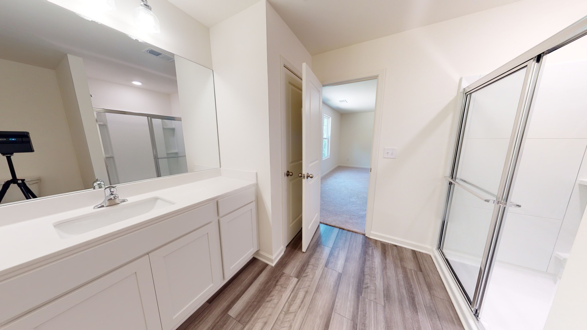 3308 Pippin Street Columbia, TN 38401 - Photo 14 of 18 a bathroom with a sink a mirror and a shower
