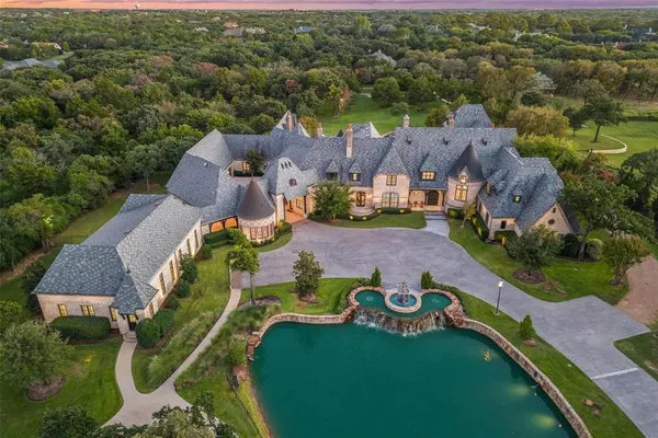 an aerial view of a house with outdoor space