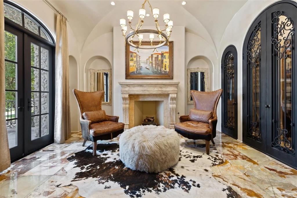 935 West Dove Road Southlake, TX 76092 - Photo 15 of 38 a living room with furniture a fireplace and a chandelier