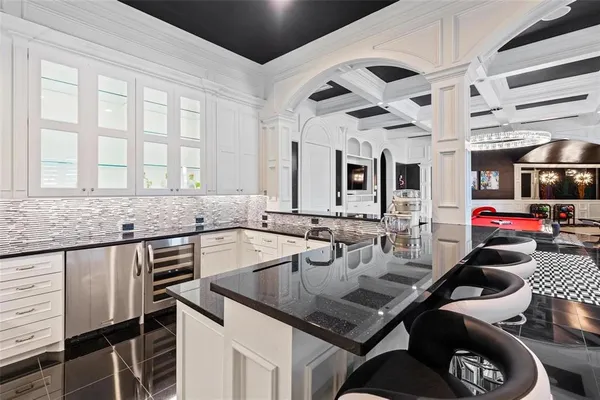 a kitchen with a stove a sink and a refrigerator