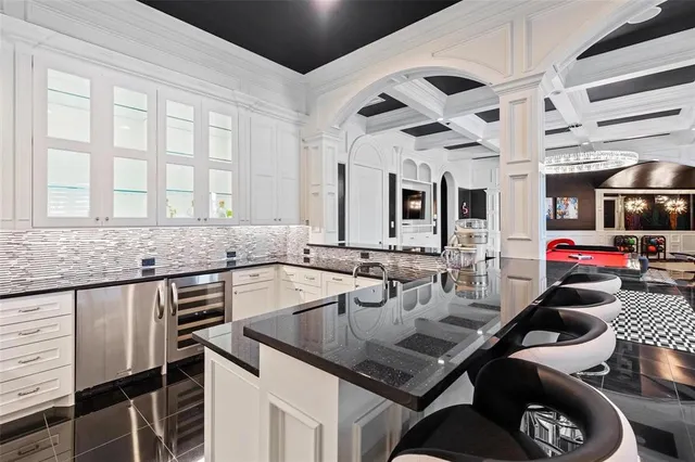 a kitchen with a stove a sink and a refrigerator