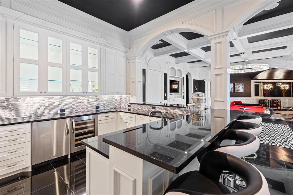 935 West Dove Road Southlake, TX 76092 - Photo 23 of 38 a kitchen with a stove a sink and a refrigerator