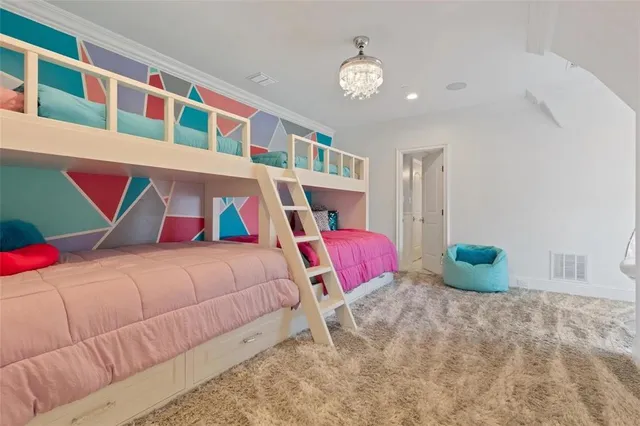 a bedroom with a bed and a lamp