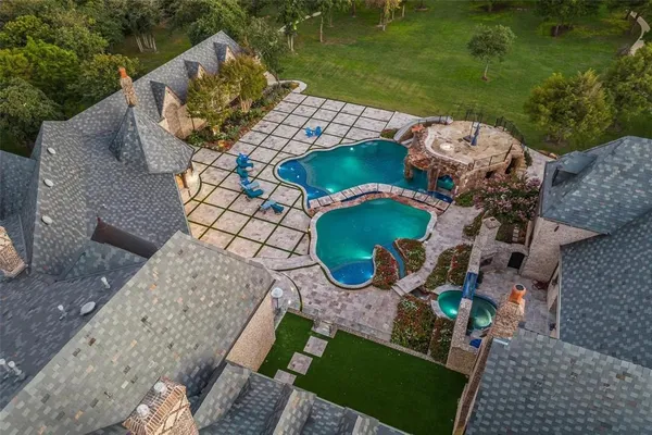 an aerial view of a house with outdoor space