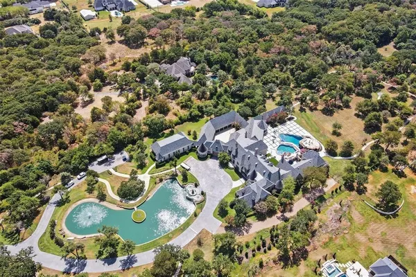 an aerial view of residential house with outdoor space and swimming pool