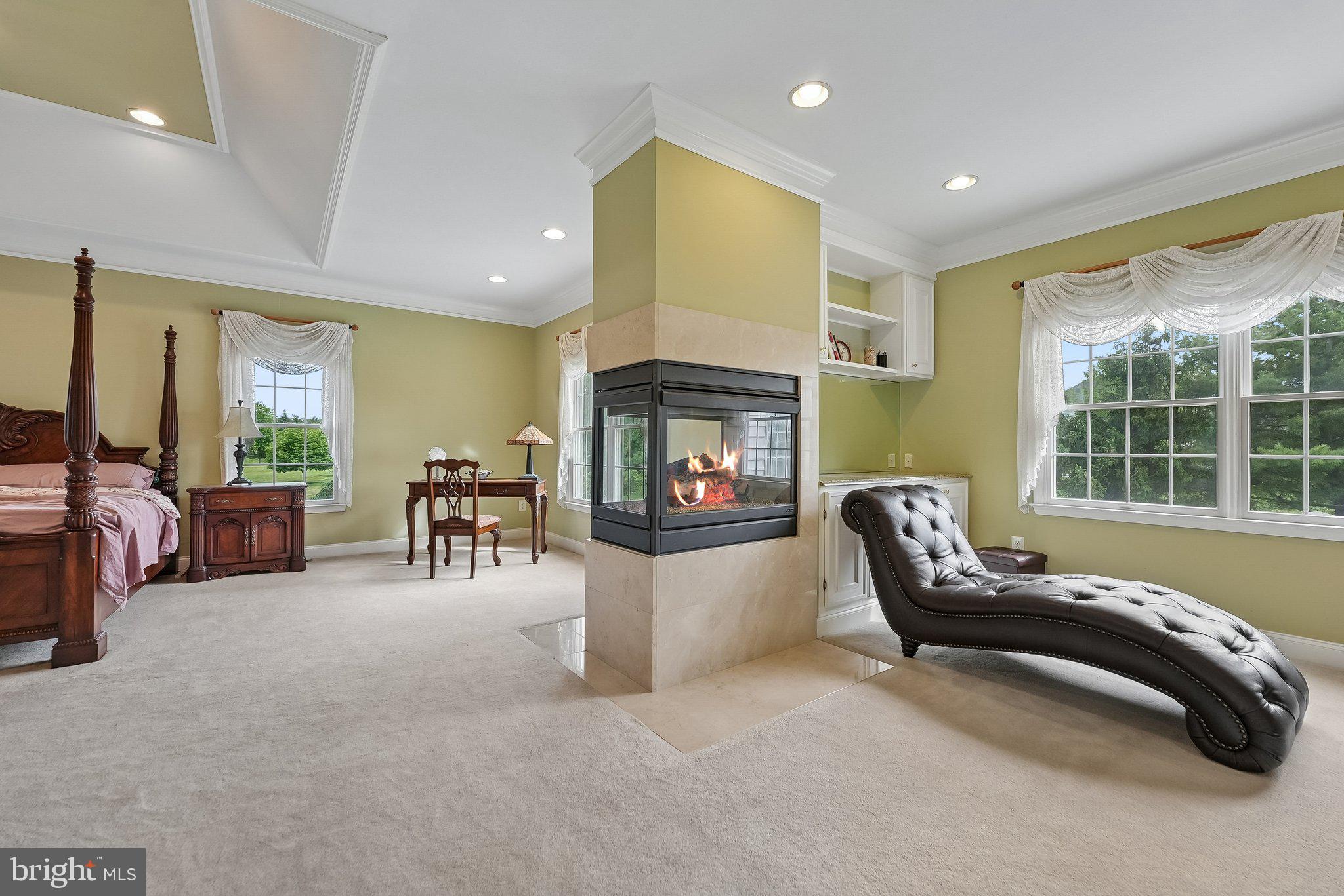 1 Baker Way Pennington, NJ 08534 - Photo 29 of 77 a living room with furniture and a fireplace