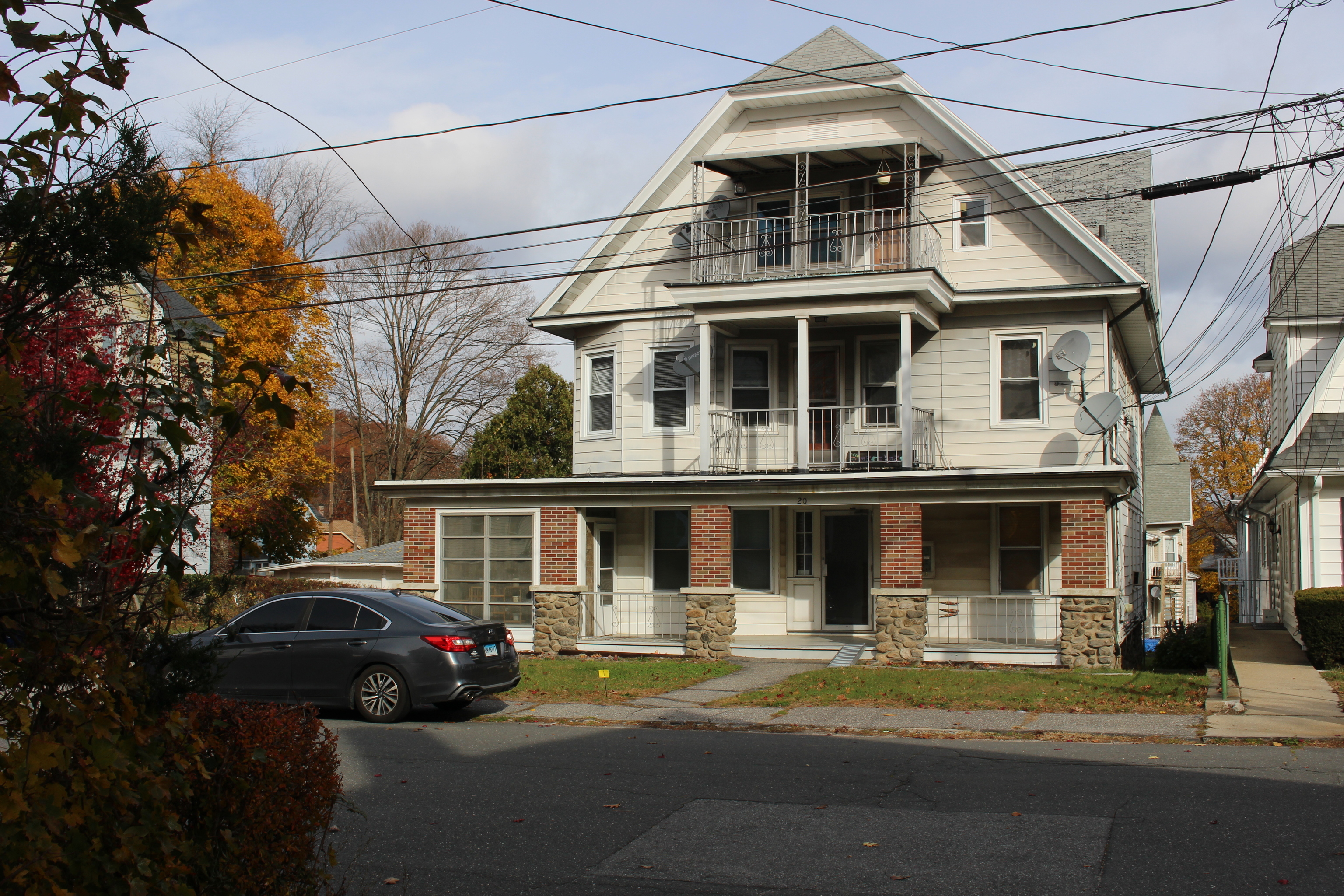 20 Merrill Street, Unit 3 Waterbury, CT 06708 - Photo 1 of 8 a front view of a house with a yard