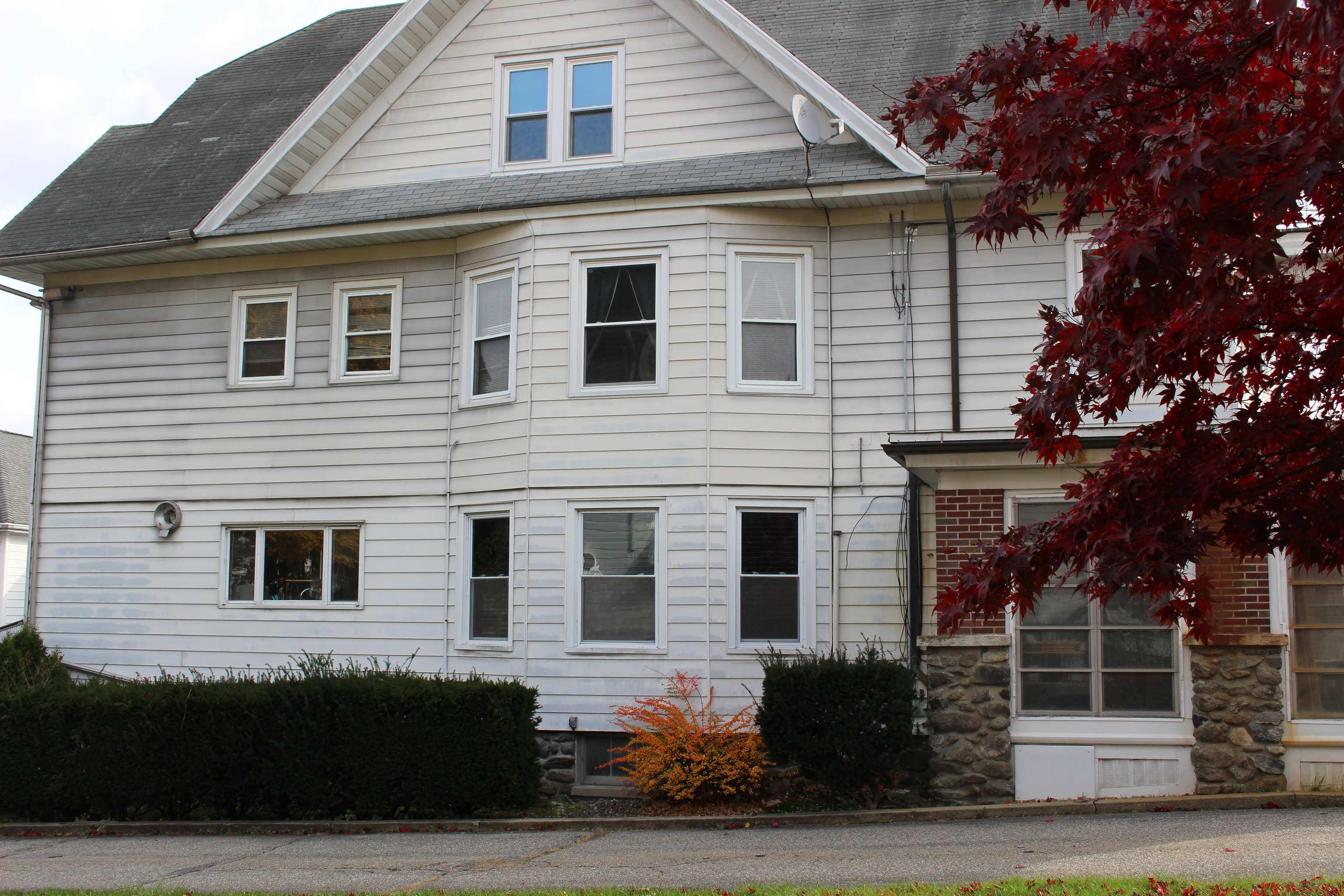 20 Merrill Street, Unit 3 Waterbury, CT 06708 - Photo 2 of 8 a front view of a house with plants