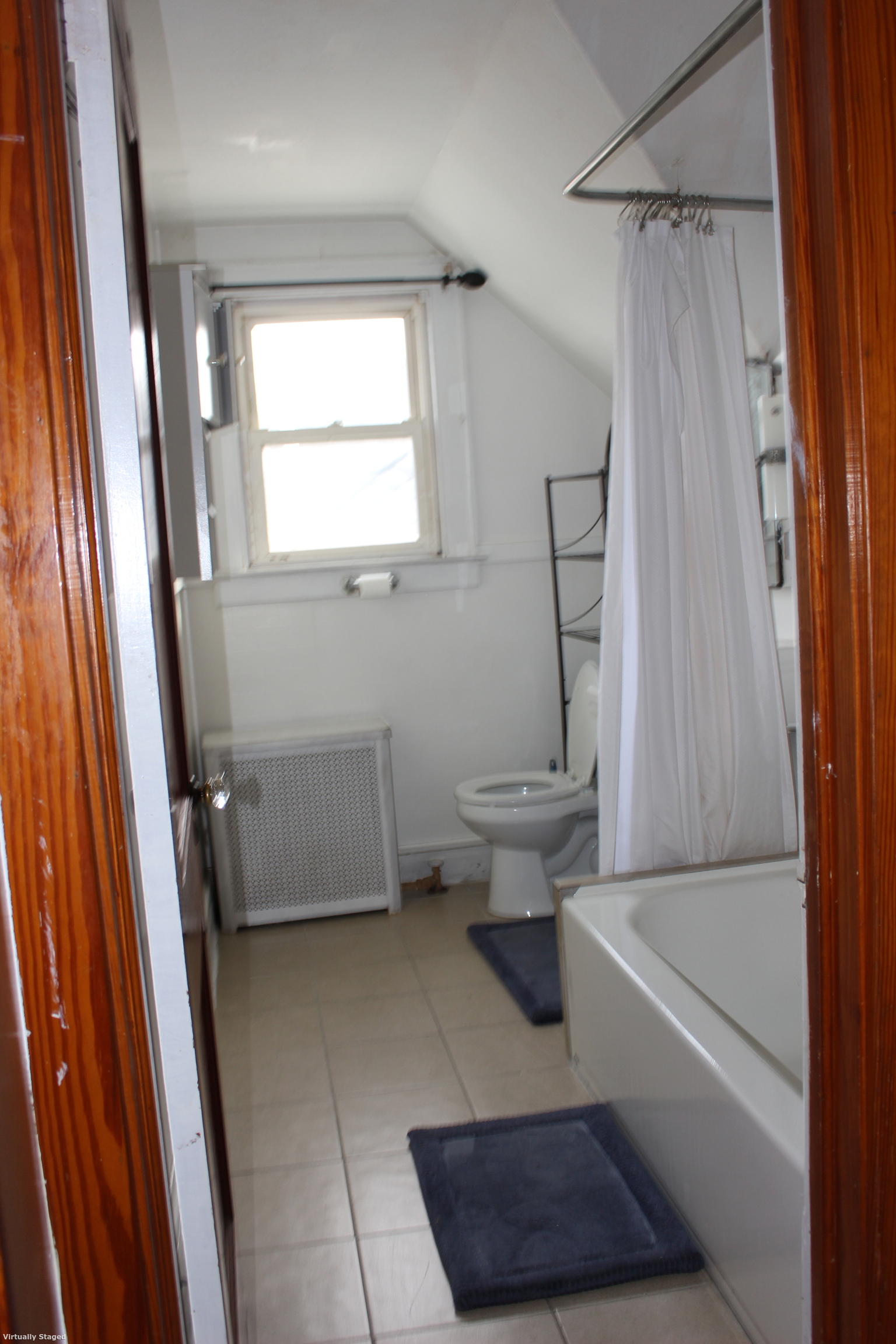 20 Merrill Street, Unit 3 Waterbury, CT 06708 - Photo 5 of 8 a bathroom with a toilet and a shower
