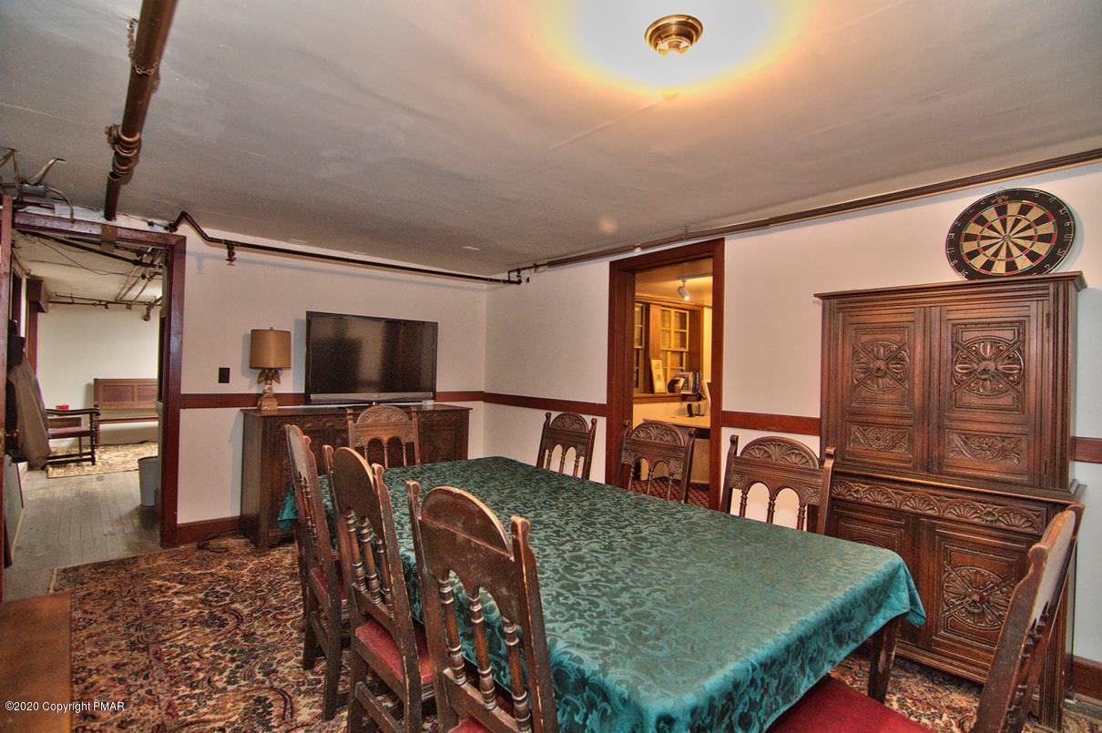 24 Summit Avenue Pocono Manor, PA 18349 - Photo 103 of 114 a living room with furniture and a flat screen tv