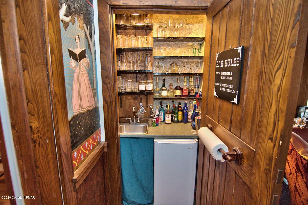 24 Summit Avenue Pocono Manor, PA 18349 - Photo 17 of 114 a room with furniture and a window