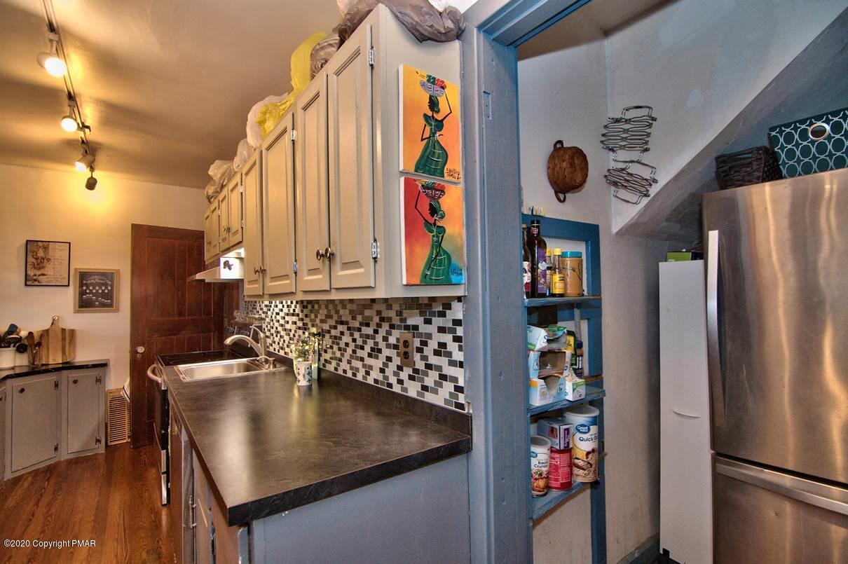 24 Summit Avenue Pocono Manor, PA 18349 - Photo 27 of 114 a kitchen with stainless steel appliances granite countertop a refrigerator and a stove