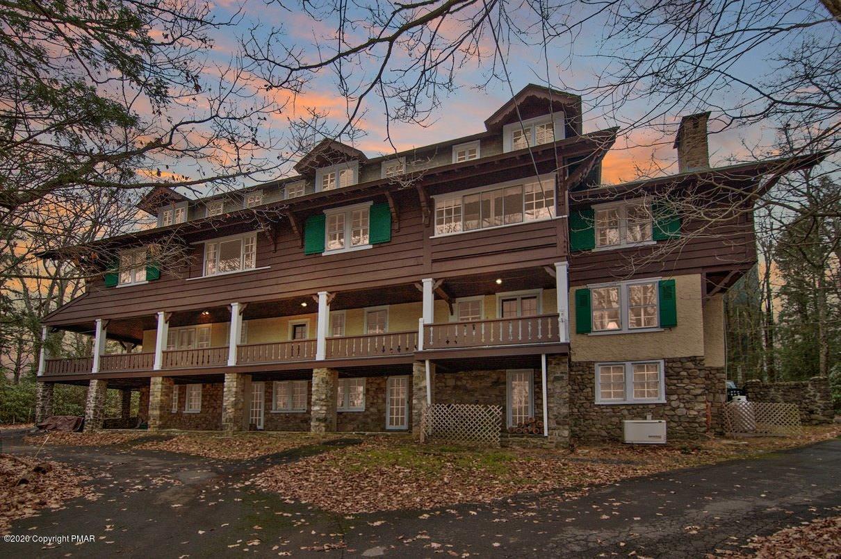 24 Summit Avenue Pocono Manor, PA 18349 - Photo 3 of 114 a front view of a residential apartment building with a yard