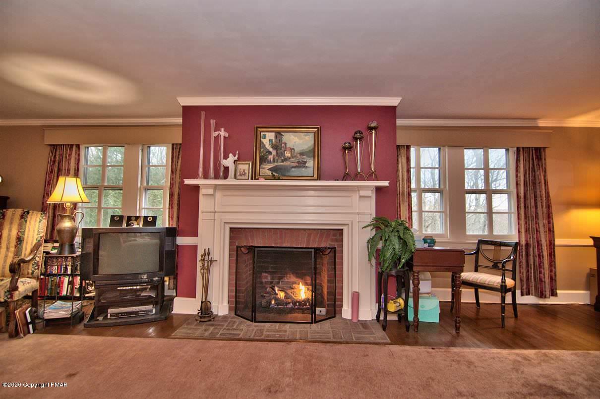 24 Summit Avenue Pocono Manor, PA 18349 - Photo 33 of 114 a living room with furniture and a fireplace