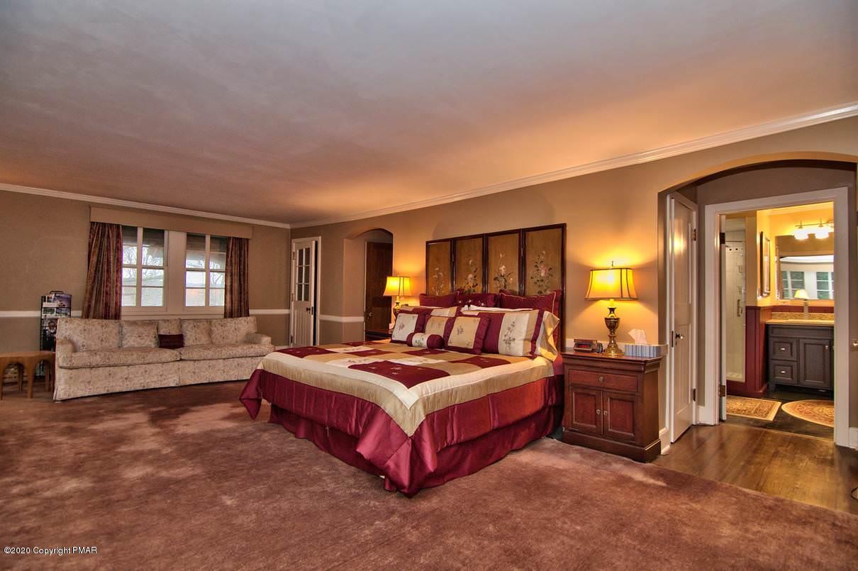 24 Summit Avenue Pocono Manor, PA 18349 - Photo 36 of 114 a bed room with a bed and a couch